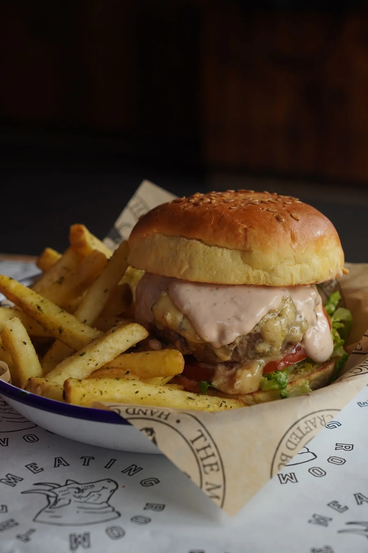 Real burger served with salad and sauce
